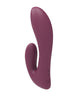 Showing the back of the rabbit style vibrator where the buttons are and charging 