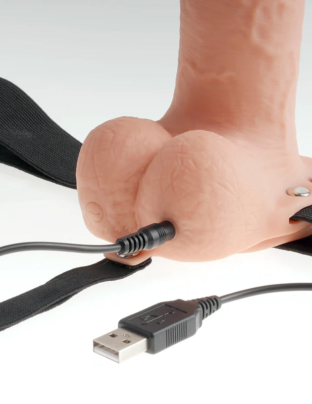 Close-up view showing the charging port on the Fetish Fantasy Series® 9" Hollow Rechargeable Strap-On with Balls Flesh.